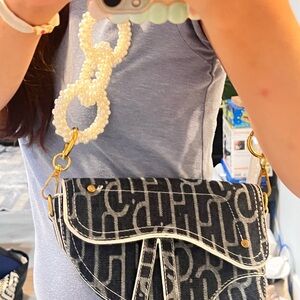 Denim Saddle bag with pearl hoop should strip
